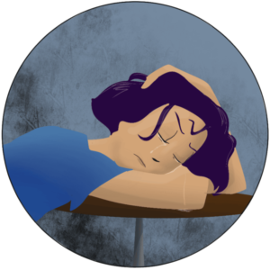 Femme en pleurs, avachie sur une table, la tête sur ses bras.